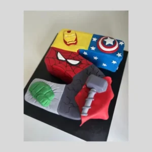 A number 5–shaped cake divided into themed sections featuring Marvel superheroes Thor, Spider-Man, Captain America, Hulk, and Iron Man.